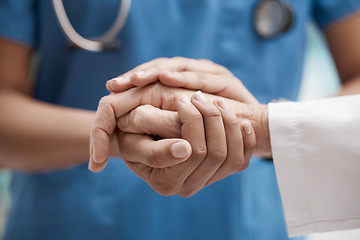 Image showing Nurse with patient holding hands for help, support and healthcare advice after cancer results, medical check or sad news of death. Zoom of doctor hand sign for trust with senior clinic consultation