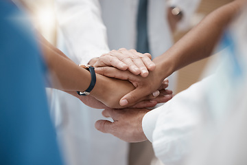 Image showing Hands, collaboration and healthcare with a medicine team in a huddle or circle in the hospital for insurance or medical. Teamwork, motivation and solidarity with a doctor and nurse group in a clinic