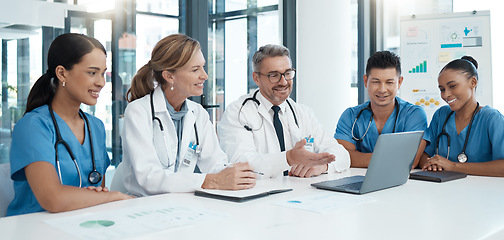 Image showing Doctor, team and meeting with laptop in conference for medical discussion or consultation at the hospital. Healthcare professionals on a video call in teamwork communication on computer at the clinic