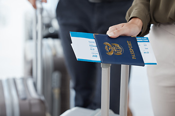 Image showing Passport, travel and airport with the hand of a passenger holding documents while waiting for a flight. Immigration, identity and boarding pass with a person holding a ticket leaving for a holiday