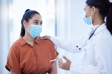 Image showing Covid, vaccine and doctor calm woman during health consultation for immunity injection for protection against disease. Mask, healthcare and syringe, medical worker help comfort scared patient.