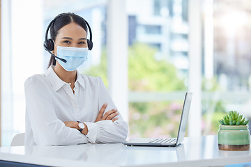 Image showing Covid, compliance and healthcare consultant in a call center with ready to help medical clients with insurance. Woman, employee and contact support worker in safety face mask with headset and mic