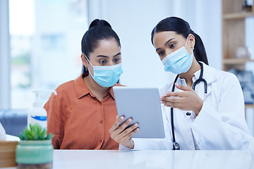 Image showing Covid, tablet and doctor consulting patient about medical results, check information or reading online exam report in hospital office. Healthcare worker woman with software tech for corona virus test