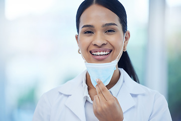 Image showing Doctor, woman and smile with mask in portrait while at work in hospital for health, safety and wellness against covid 19. Medic, ppe and happy working in clinic, breathing and end of pandemic