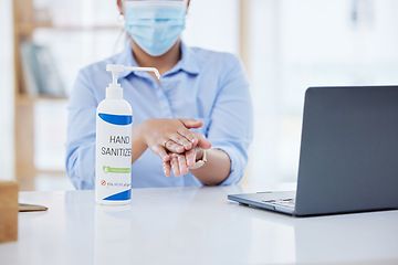 Image showing Covid, business woman at desk and hand sanitizer for hygiene and safety, protection against virus. Cleaning, laptop and health compliance of corporate, medical policy and clean working environment.