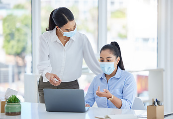 Image showing Covid, work and business women in the office with laptop and wearing face mask. Tech, 404 and team working to fix problem, mistake and glitch on computer with mask in the workplace for covid 19