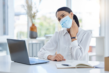 Image showing Covid, neck pain and a woman with laptop and face mask in office. Online work, overtime and a tired businesswoman at desk with hand on neck. Stress, injury and anxiety, lady working during pandemic.