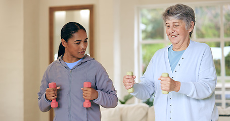 Image showing Dumbbell weights, physiotherapy and an old woman with a caregiver in a nursing home for training. Health, fitness or exercise with a senior patient and person in a living room for physical therapy