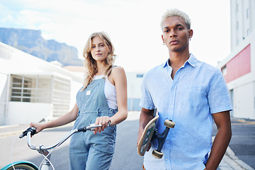 Image showing Bike, skate and portrait of urban couple, gen z street fashion and outdoor activity. Young city man and woman, streetwear and alternative transport, carbon neutral travel with skateboard and bicycle.