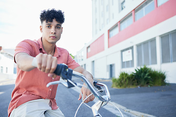 Image showing Man on bicycle in the street, eco friendly and sustainability with an urban background. Transportation, gen z and trendy youth in cityscape portrait, environment safety and clean energy lifestyle.