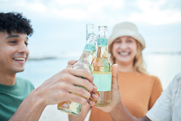 Image showing Beer, toast and friends in celebration at the beach for holiday, summer and freedom to travel together. Group of people cheers with alcohol to celebrate a party, vacation and relax by the sea