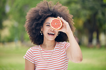 Image showing Woman, happy and diet with grapefruit for healthy detox and face in a nature park in summer. Portrait of female vitamin c skincare and wellness with beauty keeps her fresh, wellness outdoor in summer