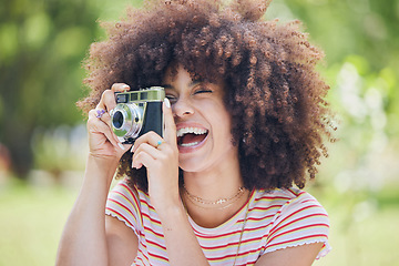 Image showing Photographer, happy and woman with a camera in nature enjoying taking pictures of a natural environment. Smile, happiness and Afro girl outdoors shooting creative shots as a freelancer in photography