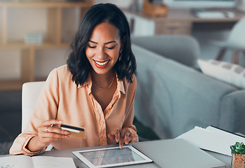 Image showing Shopping for online purchase with credit card and tablet, buying products for house and making payment with technology. Smiling and cheerful woman holding debit card for banking, budget and bills