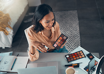 Image showing Female lifestyle, makeup vlogger recording a tutorial on phone for social media. Top view of beauty influencer testing eyeshadow palette colors or cosmetics on a live streaming video to share online