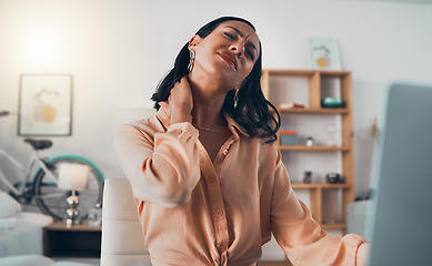 Image showing Suffering from neck pain or injury female freelancer, copywriter and work from home remote worker. Young, stressed and tired online digital marketer working overtime on laptop for a freelance client