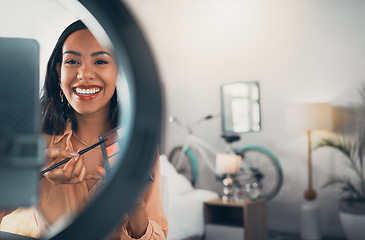 Image showing Beauty influencer, vlogger or podcast host talking with a phone to film live stream makeup tutorial with eyeshadow makeup palette. Excited woman using technology to promote a cosmetic product online