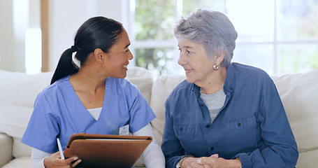Image showing Consulting, home and nurse with senior woman on sofa for medical care, support and service. Healthcare, retirement and caregiver with elderly patient documents for insurance, diagnosis and report