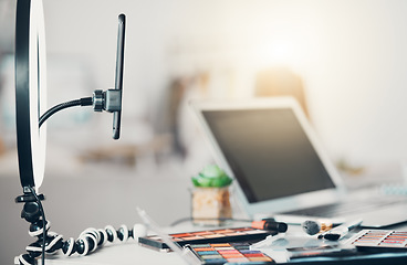 Image showing Phone streaming, makeup or social media beauty tutorial with blog, laptop or cosmetic palette for content creator, influencer or blogger. Closeup of eyeshadow, face product or brushes in empty studio