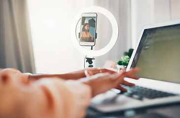 Image showing Social media influencer, content creator and vlogger typing online blog on her laptop about lifestyle and glamour. Entrepreneur, freelancer and creative woman recording herself working as a blogger