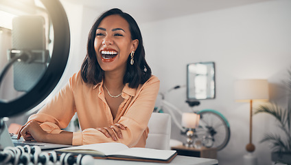 Image showing Social media and business influencer streaming live tutorial, laughing and talking to her online followers. Guiding subscribers on finance, investment, banking and accounting while enjoying her blog