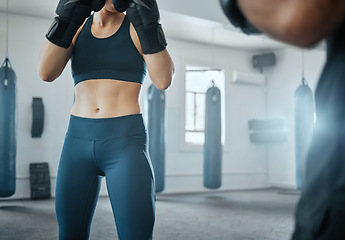 Image showing Female fitness boxing with trainer, learning self defense with coach at gym and training for wellness at a sports center with an instructor. Man teaching an athletic woman to fight and do cardio