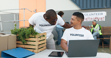 Image showing Team, volunteer and laptop for donation, charity and outreach program by people outdoor. Tech, collaboration and men in nonprofit, support and social responsibility, community service and NGO