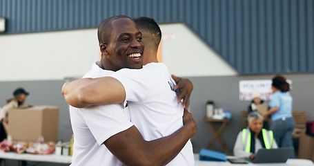 Image showing Volunteer, hug and men excited for charity drive, donation and community service with boxes. Collaboration, volunteering and group of people embrace, happy and smile for NGO, recycle and teamwork