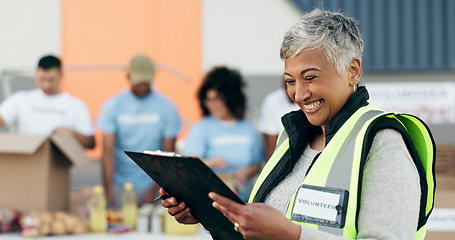 Image showing Woman, volunteering and checklist of food donation, NGO project and community service management or leadership. Senior manager reading clipboard, documents and happy for charity or nonprofit work