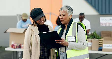 Image showing Woman volunteering, manager checklist and food donation, NGO project or community service management or support. Nonprofit people or senior leader help, planning or registration documents for charity