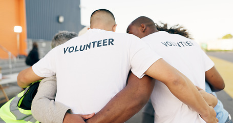 Image showing Recycle, charity and a volunteer group in a huddle together for teamwork, unity or solidarity. Community, team building and sustainability with ngo people hugging in support of an earth day project