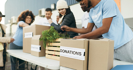 Image showing Teamwork, people volunteering and food boxes on table for charity event with care, kindness and trust. Community donation, men and women at ngo with grocery package distribution at non profit project