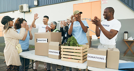 Image showing Volunteer, celebration and people with box for donation, charity drive and community service. Collaboration, volunteering and excited men and women clapping for success in NGO, recycle and teamwork