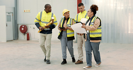 Image showing Construction site, blueprint and business people walking in a building planning, discussion or renovation idea. Architecture, project management and engineer team in warehouse for design conversation