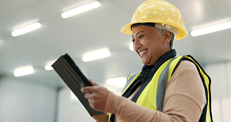 Image showing Engineering, woman and tablet at construction site inspection, building development and industrial renovation. Excited manager on digital tech, design software and architecture planning in warehouse