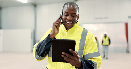 Image showing Happy black man, engineer and phone call with tablet for communication, networking or discussion at warehouse. African male person, architect or contractor smile on mobile smartphone for conversation