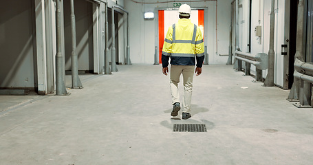 Image showing Warehouse, back of man and engineer walking at empty industrial plant, manufacturing production or construction. Factory, rear view and worker or technician check storage, distribution and logistics