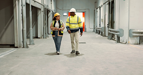 Image showing Engineer woman, man and walking in warehouse for planning discussion for manufacturing, logistics or industry. Teamwork, thinking and brainstorming for vision, supply chain and commerce in factory
