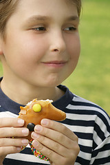 Image showing Boy with a sweet treat