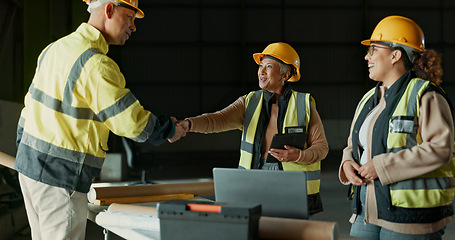 Image showing Engineering team, factory people and handshake for manufacturing agreement, construction deal or collaboration. Greeting, warehouse project and partner shaking hands for hello, welcome or thank you