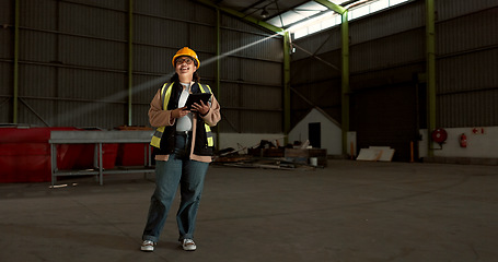 Image showing Engineer woman, tablet and smile in warehouse for logistics, supply chain or thinking process with app. Employee, helmet and happy with ideas at shipping workshop, factory and vision with touchscreen