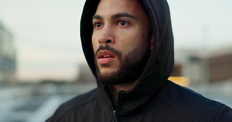 Image showing Fitness, breathing and thinking, man in city on rest from morning wellness workout in hoodie. Relax, face and tired athlete on calm urban exercise with fatigue, reflection and outdoor air on street.