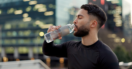 Image showing Man, drinking water and fitness in city after workout, exercise or outdoor training for natural sustainability. Thirsty male person with mineral drink in rest, recovery or break for hydration in town