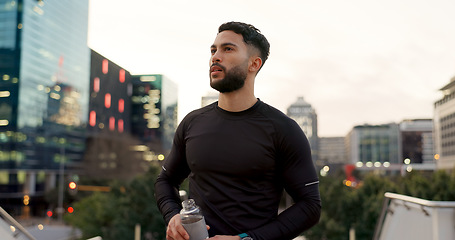 Image showing Fitness, face and thinking, man in city on rest from morning workout with water bottle. Relax, breathing and tired athlete with calm urban exercise with fatigue, reflection and drink on street