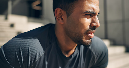 Image showing Face, fitness and a tired sports man outdoor in the city for commitment to health or wellness. Fatigue, breathing and sweating with an exhausted young athlete in an urban town for exercise training