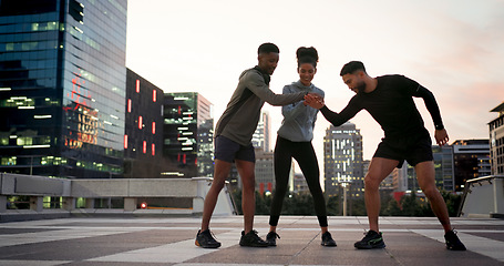 Image showing Friends, group or runner with hands together outdoor for fitness, exercise or motivation during workout. Athlete, men and woman or high five for team building, happy and support for running challenge