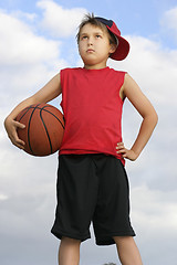 Image showing Standing child holding a basketball