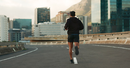 Image showing Sports, back and running in morning on city, street and bridge for fitness, workout and marathon training. Athlete, man or exercise on South Africa road for wellness, health or triathlon performance