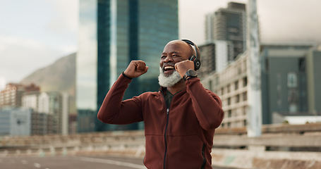 Image showing Fitness, excited and senior man, headphones, city and achievement with workout, streaming music and radio. African person, pensioner and runner with headset, progress and exercise wellness or outdoor