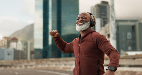 Image showing Fitness, celebration and senior man, headphones, city and achievement with workout, streaming music and radio. African person, pensioner and runner with headset, progress and exercise wellness or joy